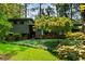 Well-maintained exterior with brick accents, mature landscaping, and a welcoming entrance at 3408 Chestnut Dr, Doraville, GA 30340
