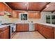 Kitchen features tile floor, stainless steel appliances, and wood cabinets at 3408 Chestnut Dr, Doraville, GA 30340