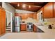 Well-equipped kitchen featuring stainless steel appliances, wood cabinetry, and a bright countertop at 3408 Chestnut Dr, Atlanta, GA 30340
