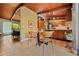 Eat-in kitchen features wood ceiling, tile floors, and glass table at 3408 Chestnut Dr, Doraville, GA 30340