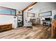 Spacious living room with hardwood floors, a cozy chair, a desk area, and plenty of natural light at 3408 Chestnut Dr, Atlanta, GA 30340