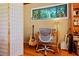 Office space with a vintage floral wallpaper, hard wood floors and a sun-filled window at 3408 Chestnut Dr, Doraville, GA 30340