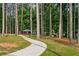 Scenic view of a curved path leading to a park gazebo and play area at 3408 Chestnut Dr, Doraville, GA 30340