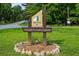 Northwoods neighborhood sign surrounded by a stone garden at 3408 Chestnut Dr, Doraville, GA 30340