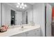 Bright bathroom with white cabinetry, large mirror, and coordinated decorative towels at 1286 Creekside Se Ter, Smyrna, GA 30082