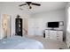 Bedroom with closet access, carpet flooring, and a gray and blue floral bed spread at 1286 Creekside Se Ter, Smyrna, GA 30082