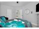 Stylish bedroom with a decorative round mirror and views into the adjacent bathroom at 1286 Creekside Se Ter, Smyrna, GA 30082