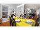 Lovely dining room area featuring modern lighting, backyard access, and view into the kitchen and living space at 1286 Creekside Se Ter, Smyrna, GA 30082