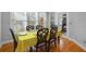 Well-lit dining room featuring hardwood floors, backyard access and an ornate dining set at 1286 Creekside Se Ter, Smyrna, GA 30082