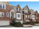 Charming townhome exteriors with brick, garage, manicured landscaping, and inviting curb appeal at 1286 Creekside Se Ter, Smyrna, GA 30082