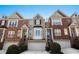 Attractive townhomes with brick exteriors, attached garages, and well-maintained landscaping at 1286 Creekside Se Ter, Smyrna, GA 30082