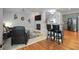 Inviting open-concept living space with a fireplace, kitchen, and bar seating at 1286 Creekside Se Ter, Smyrna, GA 30082
