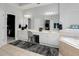 Bright bathroom featuring double sinks, a soaking tub, and an enclosed walk-in shower at 1286 Creekside Se Ter, Smyrna, GA 30082