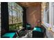 Cozy patio area with brick wall, outdoor seating, and forest views at 1286 Creekside Se Ter, Smyrna, GA 30082