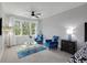 Bright sitting area with a large picture window, carpet flooring, and two chairs at 1286 Creekside Se Ter, Smyrna, GA 30082