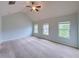 Bright bedroom featuring vaulted ceilings, three windows offering ample natural light at 1531 Iris Walk, Jonesboro, GA 30238