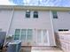 A view of the home's back exterior with a door and windows, and the AC unit visible at 1531 Iris Walk, Jonesboro, GA 30238