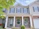 Charming townhome with stone facade, inviting entrance, and well-maintained landscaping at 1531 Iris Walk, Jonesboro, GA 30238