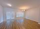 Living area with double french door access to backyard and hardwood flooring at 1531 Iris Walk, Jonesboro, GA 30238