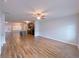 Spacious living area featuring hardwood floors and open floor plan to the kitchen at 1531 Iris Walk, Jonesboro, GA 30238