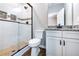 Bathroom featuring tiled walk-in shower, toilet, and granite vanity with white cabinets at 1960 York Dr, Canton, GA 30114