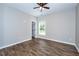 Spacious bedroom features hardwood floors, neutral walls, and natural light from a window at 1960 York Dr, Canton, GA 30114