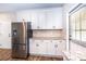Bright kitchen featuring stainless steel appliances, white cabinets, and granite countertops at 1960 York Dr, Canton, GA 30114
