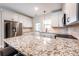 Modern kitchen with granite countertops, stainless steel appliances, and white cabinets at 1960 York Dr, Canton, GA 30114