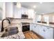 Modern kitchen boasts stainless steel appliances, granite counters and bright white cabinetry at 1960 York Dr, Canton, GA 30114