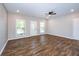 Bright living room featuring hardwood floors, neutral walls, and natural light from windows at 1960 York Dr, Canton, GA 30114