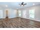 Bright living room with sleek wood flooring, large windows and neutral tones, creating a modern and spacious atmosphere at 1960 York Dr, Canton, GA 30114