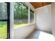 Enclosed porch with serene views of the surrounding green space, providing a peaceful retreat at 1960 York Dr, Canton, GA 30114