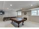 Finished basement with fireplace, recessed lighting, and space for entertainment at 3284 Bakers Mill Ct, Dacula, GA 30019