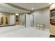 Finished basement with recreational area, sauna, and custom cabinets for storage at 3284 Bakers Mill Ct, Dacula, GA 30019