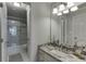 Bathroom featuring a vanity, a framed mirror, and a standing shower at 3284 Bakers Mill Ct, Dacula, GA 30019