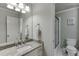 This bathroom features granite countertops, a framed mirror, and a standing shower at 3284 Bakers Mill Ct, Dacula, GA 30019