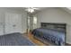 This bedroom features two beds, a ceiling fan, and access to an ensuite bathroom at 3284 Bakers Mill Ct, Dacula, GA 30019