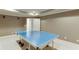 Spacious game room featuring a ping pong table and ample lighting at 3284 Bakers Mill Ct, Dacula, GA 30019