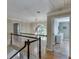 View of the hallway, railing, and an arch window at 3284 Bakers Mill Ct, Dacula, GA 30019
