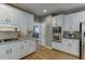 Contemporary kitchen featuring granite countertops, stainless steel appliances, and modern fixtures at 3284 Bakers Mill Ct, Dacula, GA 30019