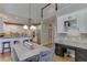 Bright eat-in kitchen features white cabinets, granite countertops, and stainless appliances at 3284 Bakers Mill Ct, Dacula, GA 30019