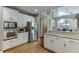 Spacious kitchen with stainless steel appliances, granite countertops and hardwood floors at 3284 Bakers Mill Ct, Dacula, GA 30019