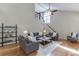 Bright living room features hardwood floors, neutral paint, ceiling fan, and an abundance of natural light at 3284 Bakers Mill Ct, Dacula, GA 30019