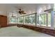 Covered patio with brick features and a view of the wooded backyard at 3284 Bakers Mill Ct, Dacula, GA 30019