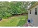 Expansive backyard with lush lawn, mature trees, and a fenced perimeter at 3792 Refinement Way, Douglasville, GA 30135