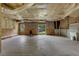 The unfinished basement has visible ceiling beams, a sliding glass door, and a utility sink at 3792 Refinement Way, Douglasville, GA 30135