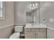 This bathroom offers a toilet and vanity with mirror at 3792 Refinement Way, Douglasville, GA 30135