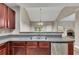 Open kitchen features stainless appliances and adjoins living area at 3792 Refinement Way, Douglasville, GA 30135