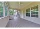 This screened porch features a ceiling fan and access to the outside at 3792 Refinement Way, Douglasville, GA 30135