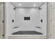 This shower features dual showerheads, a black rock floor and tiled walls at 3792 Refinement Way, Douglasville, GA 30135